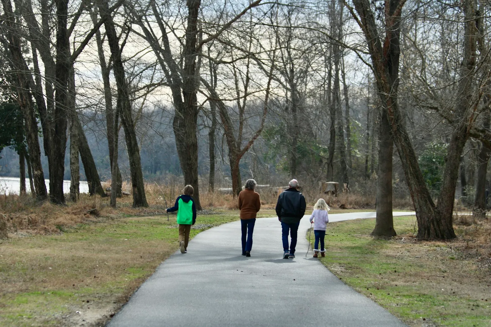 A family walking together on a park path